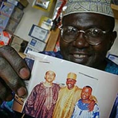in laden illuminati. Obama#39;s brother Malik holds a photo of his younger muslim brother Obama and a friend in