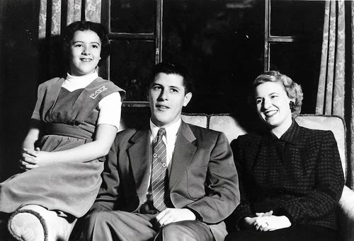 1,956: Ann appears to be around 14 years old, so this is maybe 1956. Left to right: Ann Dunham (1942-1995), Stanley Armour Dunham (1918-1992), and wife Madelyn Lee Payne (1922)
