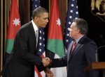 FILE - In this March 22, 2013, file photo, President Barack Obama, left, and Jordan's King Abdullah II, right, shake hands following their joint new conference at the King's Palace in Amman, Jordan