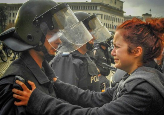 This powerful photo of a student protestor and a police officer crying has gone viral in Bulgaria.