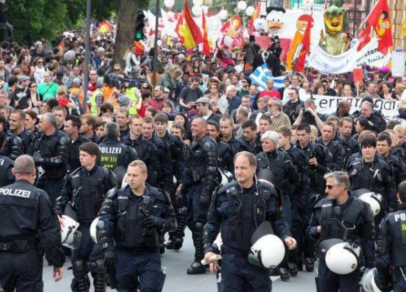 The German police took off their helmets and marched with the protesters- clearing the way for them. 