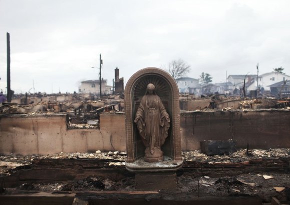 A Virgin Mary is all that remains from a home which was destroyed during Hurricane Sandy October 30, 2012 in the Breezy Point neighborhood of the Queens borough of New York City.