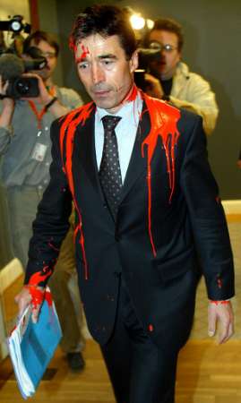 Pro-War NATO's Anders Rasmussen Attacked With Red Paint: Traitor to his country, to his surname, & to the world.