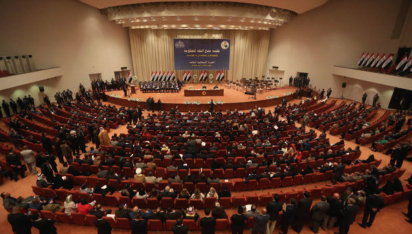 Iraqi lawmakers attend a session to approve the new government in Baghdad, Iraq. 